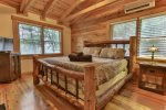Custom King log bed in the master suite on the upper level
